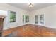 Inviting living room with hardwood floors and elegant French doors, offering a seamless flow at 6206 Hunter Ave, Charlotte, NC 28262