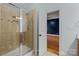 Standing shower with glass door, tile surround, and niche offering lots of space at 6565 Robin Hollow Dr, Mint Hill, NC 28227