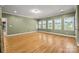 Bright, airy bedroom with many windows, beautiful hardwood floors and neutral walls at 6565 Robin Hollow Dr, Mint Hill, NC 28227