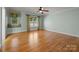 Spacious bedroom with lots of sunlight, hardwood floors, and a ceiling fan at 6565 Robin Hollow Dr, Mint Hill, NC 28227