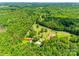 An aerial view of the home nestled among lush greenery and a tranquil country landscape at 675 Ormand Rd, York, SC 29745