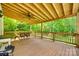 Spacious covered back deck with a ceiling fan and views of the wooded backyard at 675 Ormand Rd, York, SC 29745