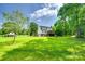 Expansive backyard with lush greenery, mature trees, and a spacious lawn at 675 Ormand Rd, York, SC 29745