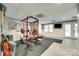 Basement with exercise equipment, fireplace, and walkout to backyard at 675 Ormand Rd, York, SC 29745