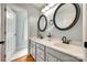 Charming bathroom featuring dual sinks, round mirrors, and modern fixtures at 675 Ormand Rd, York, SC 29745