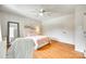 Bright bedroom features hardwood floors, soft pink accents, and a ceiling fan at 675 Ormand Rd, York, SC 29745