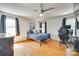 Well-lit bedroom with hardwood floors, ceiling fan, and neutral decor at 675 Ormand Rd, York, SC 29745