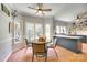Inviting breakfast nook features a round table with fruit and many windows for ample natural light and tiled floor at 675 Ormand Rd, York, SC 29745