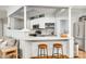 Open kitchen with white cabinets, breakfast bar, and hardwood floors at 675 Ormand Rd, York, SC 29745