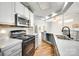 Clean kitchen features white cabinets, stainless steel appliances, and hardwood floors at 675 Ormand Rd, York, SC 29745