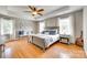 Spacious main bedroom with hardwood floors, ceiling fan and two windows with seating at 675 Ormand Rd, York, SC 29745