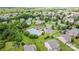 Aerial view of community pool and play area amenities surrounded by trees and lovely homes in the neighborhood at 7129 Dove Field Ln, Fort Mill, SC 29707