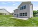 Spacious backyard with a concrete patio and lush green grass at 7129 Dove Field Ln, Fort Mill, SC 29707