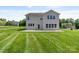 Expansive backyard with well-manicured lawn and the back of the house at 7129 Dove Field Ln, Fort Mill, SC 29707