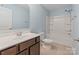 Bathroom featuring a vanity, toilet, and shower with tub at 7129 Dove Field Ln, Fort Mill, SC 29707