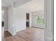Dining room with hardwood floors, chandelier, and view into kitchen at 7129 Dove Field Ln, Fort Mill, SC 29707