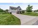 A charming two-story home features a well-manicured lawn and a long driveway at 7129 Dove Field Ln, Fort Mill, SC 29707
