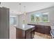 Kitchen with a center island and stainless steel appliances, with view to a living room at 7129 Dove Field Ln, Fort Mill, SC 29707