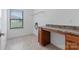 This laundry room has tile floors, counter space, and a window for natural light at 7129 Dove Field Ln, Fort Mill, SC 29707