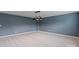 Large living room with gray walls, carpet, and modern ceiling lamp at 7129 Dove Field Ln, Fort Mill, SC 29707