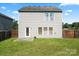 Fenced backyard featuring a grassy area, patio, and access to the home at 7136 Bullock Dr, Charlotte, NC 28214