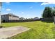 Large grassy backyard with a privacy fence and a concrete patio at 7136 Bullock Dr, Charlotte, NC 28214