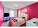 Pink bedroom with a TV, white furniture, and a cozy, personalized ambiance at 7136 Bullock Dr, Charlotte, NC 28214