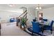 Inviting dining room with a glass table, comfortable blue chairs, and stylish decor at 7136 Bullock Dr, Charlotte, NC 28214