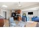 Eat-in kitchen with wooden cabinets, modern appliances, and an adjacent dining area at 7136 Bullock Dr, Charlotte, NC 28214