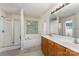 Bright bathroom featuring a separate shower, tub, dual sinks and a large window at 7218 Cascading Pines Dr, Fort Mill, SC 29708
