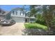 Charming two-story home featuring a well-maintained lawn, a two car garage, and a welcoming front porch at 7218 Cascading Pines Dr, Fort Mill, SC 29708