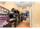 Hallway to finished basement features multiple arcade games and sign stating Dave's Personal Cave at 7218 Cascading Pines Dr, Fort Mill, SC 29708