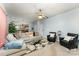 A well-lit living room showcases a sofa, armchairs, a patterned rug, and a seamless transition to the adjacent kitchen at 7218 Cascading Pines Dr, Fort Mill, SC 29708