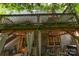 Multi-level deck with privacy fence, outdoor dining, lights, and ceiling fan at 7218 Cascading Pines Dr, Fort Mill, SC 29708