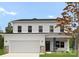 Charming two-story home featuring a pristine white exterior, attached garage, and lovely front yard landscaping at 8032 Joy Crossing Ln, Charlotte, NC 28214