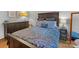 Main bedroom featuring a dark wood bed frame and matching dresser set at 911 Munday Ct, Charlotte, NC 28270