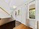 Inviting foyer with tile flooring, showcasing a staircase and a view into the living area beyond at 911 Munday Ct, Charlotte, NC 28270