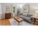 Cozy living room with a comfortable sofa, stylish decor, and natural light streaming through the windows at 911 Munday Ct, Charlotte, NC 28270