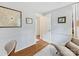 The office has chair rail, art on walls, and the view to the entry at 911 Munday Ct, Charlotte, NC 28270