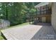 Spacious backyard features patio, deck, and shed, perfect for outdoor living at 9117 Castle Garden Ln, Charlotte, NC 28215
