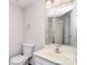 Half bath featuring a vanity with framed mirror, toilet, and framed glass shower at 9117 Castle Garden Ln, Charlotte, NC 28215