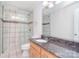 Bathroom features a granite countertop vanity and a glass enclosed tile shower at 9117 Castle Garden Ln, Charlotte, NC 28215