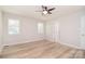 Bedroom featuring wood floors, neutral walls, and ceiling fan at 9117 Castle Garden Ln, Charlotte, NC 28215