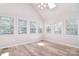 Bedroom featuring vaulted ceilings, wood flooring, and sun-filled windows at 9117 Castle Garden Ln, Charlotte, NC 28215