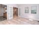 Dining area with wood floors, French doors, and natural light at 9117 Castle Garden Ln, Charlotte, NC 28215