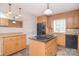 Spacious kitchen with stainless steel appliances, granite counters, and wood cabinets at 9117 Castle Garden Ln, Charlotte, NC 28215