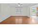 This dining room has hardwood floors, neutral walls, and a chandelier at 9121 Four Acre Ct, Charlotte, NC 28210