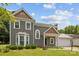 Attractive two-story home featuring a well-maintained lawn, neatly trimmed bushes, and a two car garage at 9121 Four Acre Ct, Charlotte, NC 28210