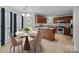 Eat-in kitchen with stainless steel appliances, granite countertops, tile floors, and a view to the exterior at 9121 Four Acre Ct, Charlotte, NC 28210