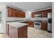 The kitchen has hardwood cabinets, stainless steel appliances, granite countertops, and a breakfast nook at 9121 Four Acre Ct, Charlotte, NC 28210